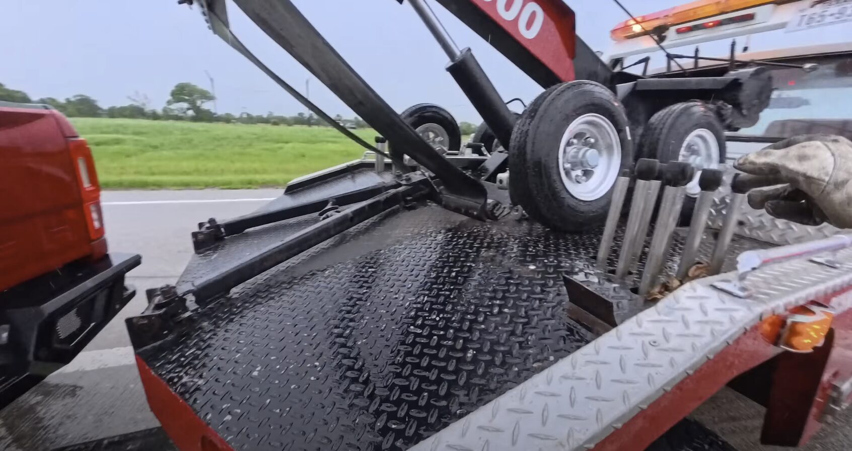 Professional heavy-duty towing equipment in action Heavy-duty tow truck loading vehicle for transport